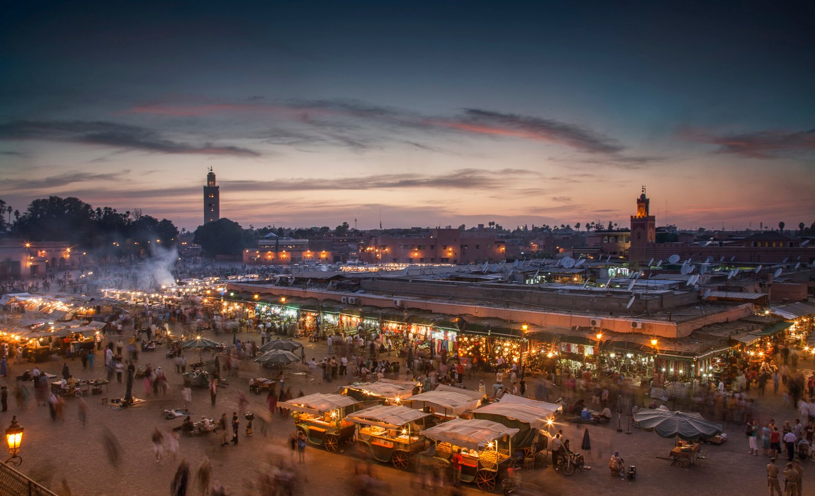 Jemaa el-Fnaa square in Marrakech illuminated at dusk