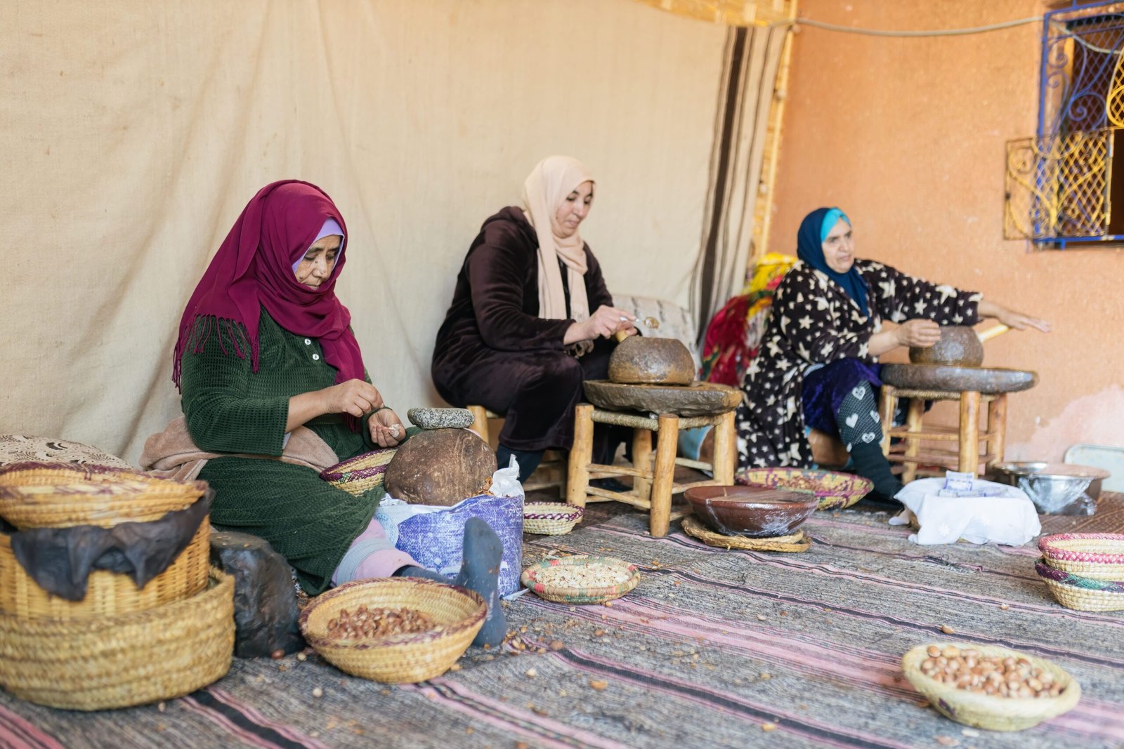 Women making argan oil